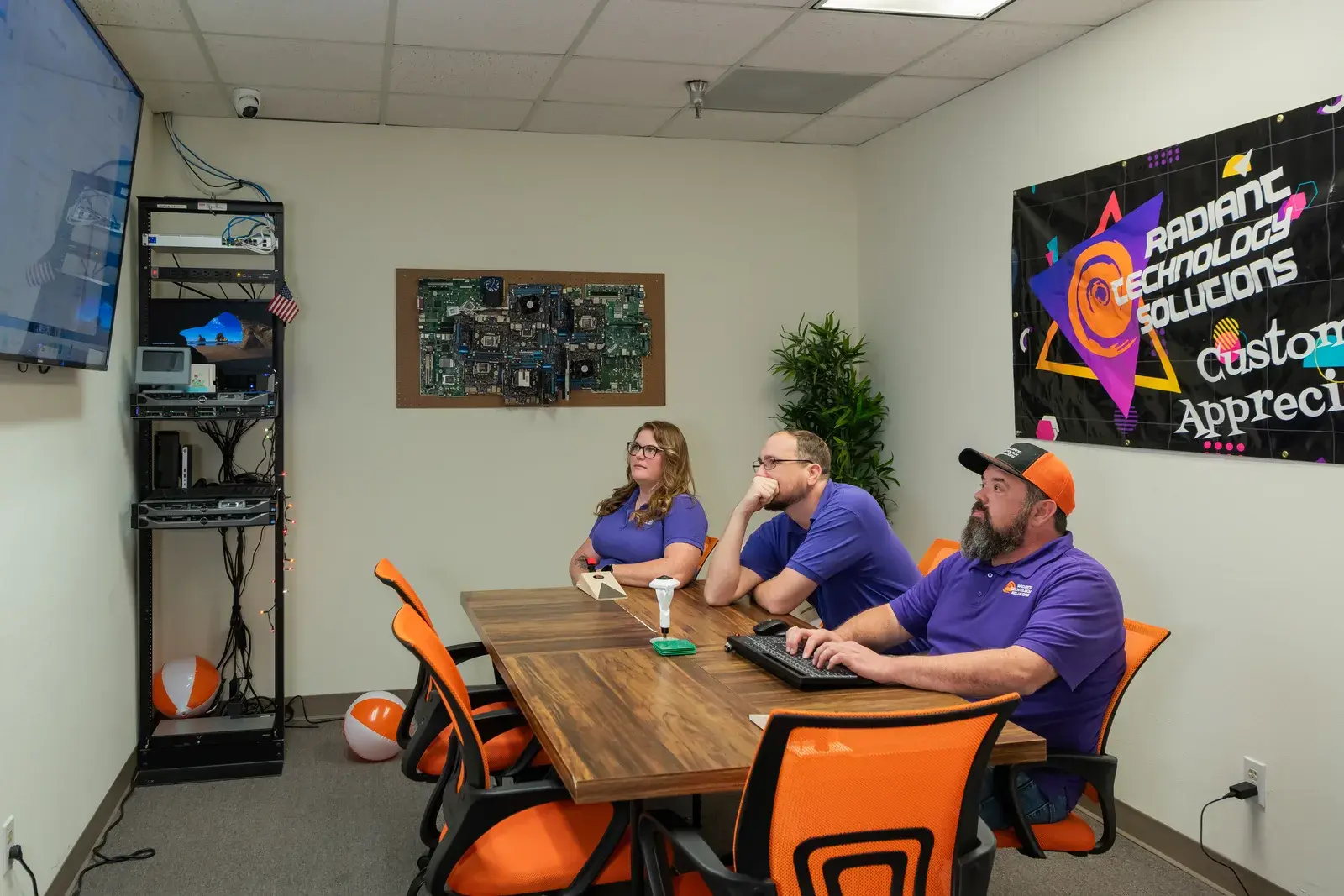Radiant Technology Solutions IT support team meeting in a conference room in Tarpon Springs, Florida