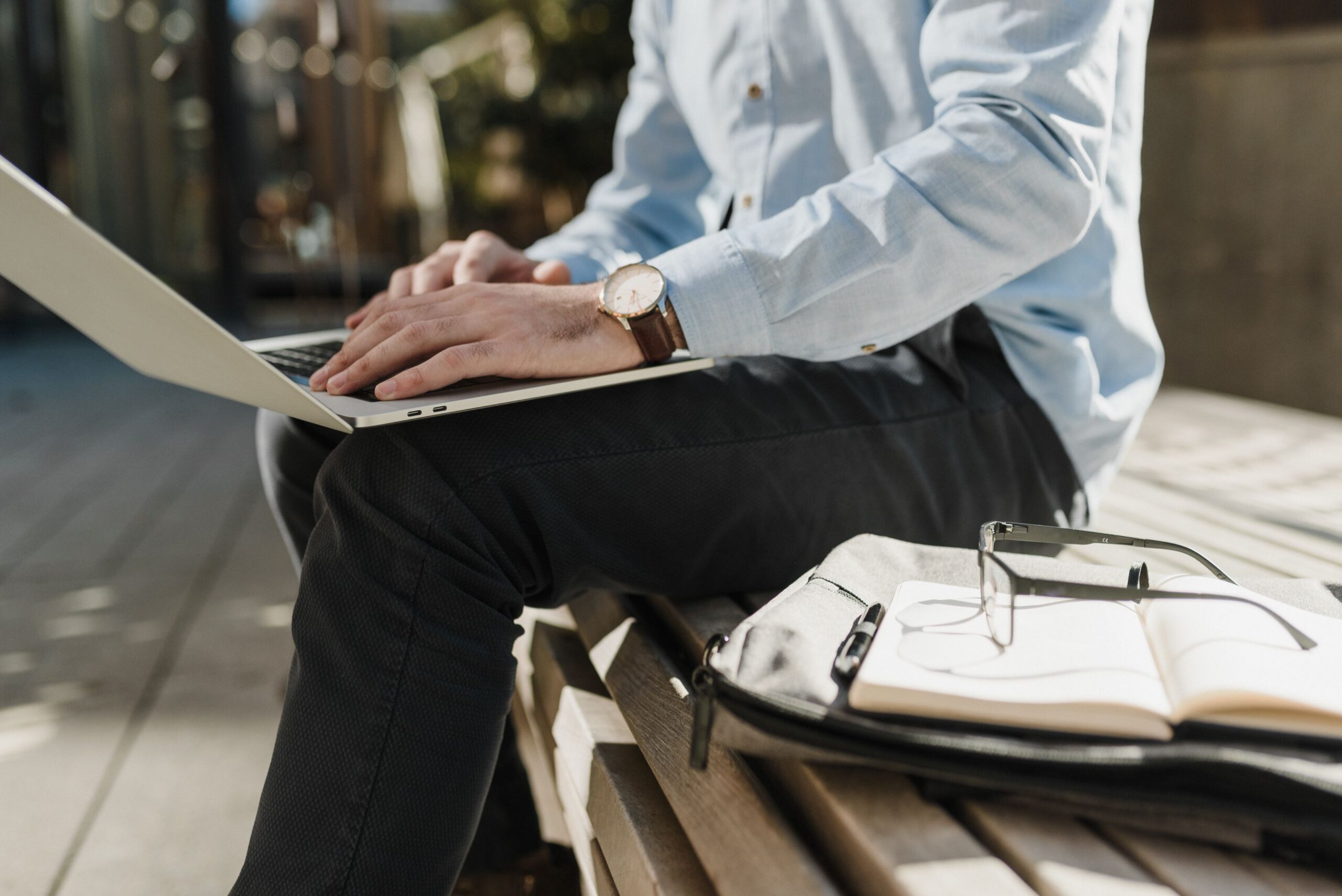 Man working on bench in park