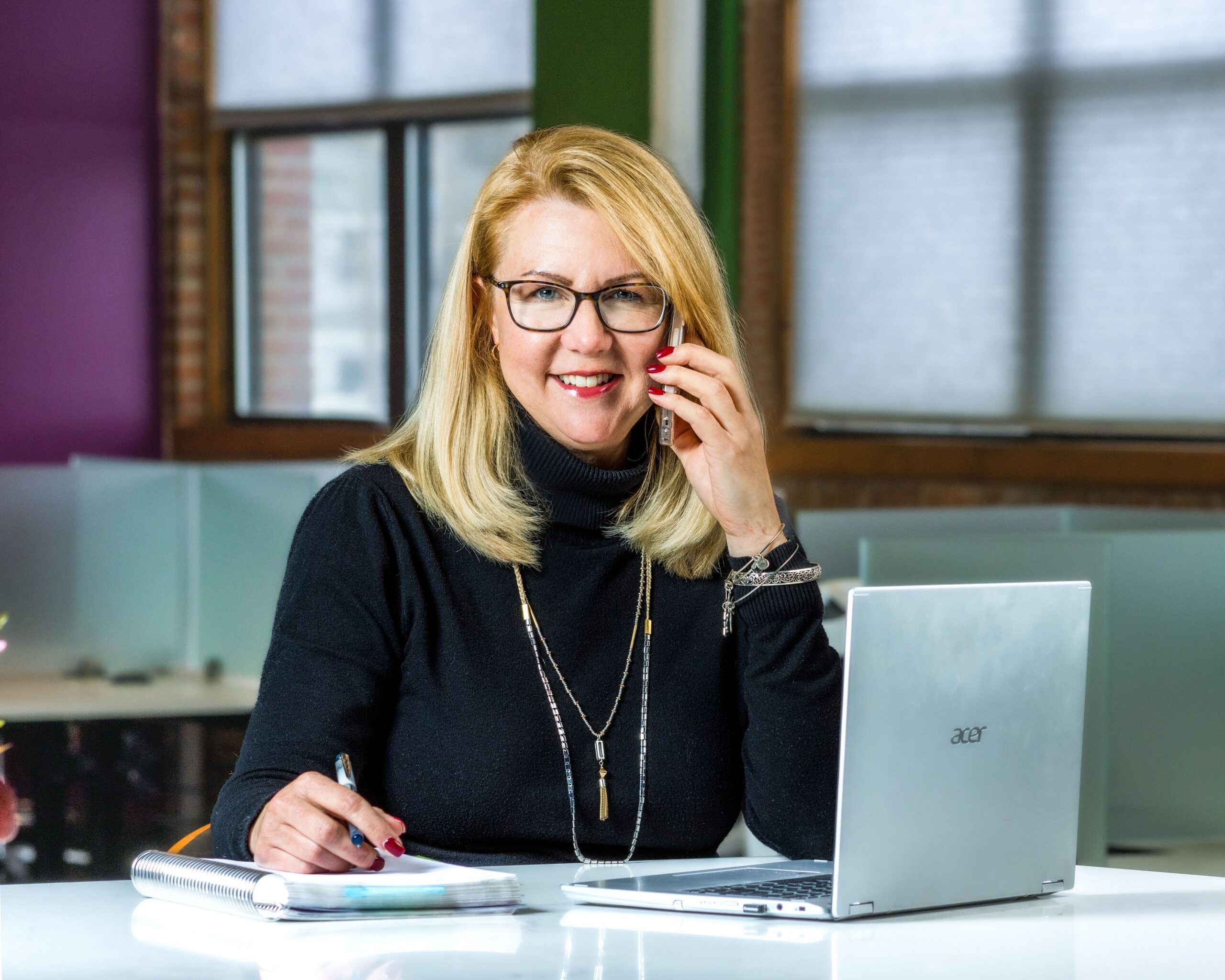 Tampa CEO on phone working in office